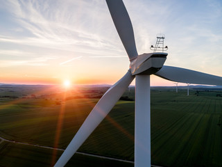 Sunset above the windmill on the field