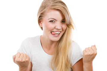 Happy positive blonde woman clenching fists