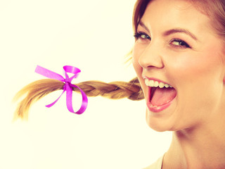 Teenage girl in braid hair making happy face