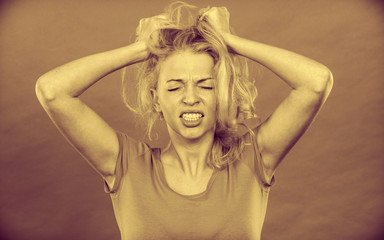 Stressed, frustrated, depressed young woman in pain