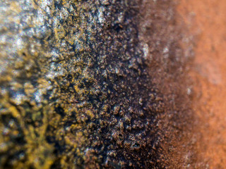 multi-colored paint on uneven surface