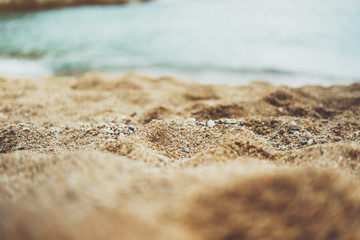 coastline beach on sunny day background of sea and sky, gold sand close up blur, tourism relax concept, seascape perspective vacation, summer walk on ocean, mock up