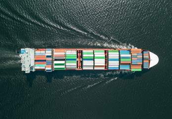 Aerial view of container ship sailing in sea