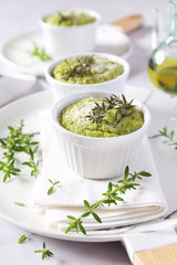 Appetizer: green vegetable soufflе with parmesan cheese and olive oil, three servings