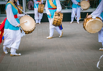 Blured picture of Musicians play on a Korean traditional percussion musical instrument Janggu. Samul nori or Pungmul on the festival of Korean culture