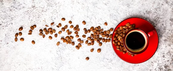Wall murals Kitchen Coffee Beans Fragrant in the Red Cup on the Gray Background. Top View. Copy space for Text.Banner
