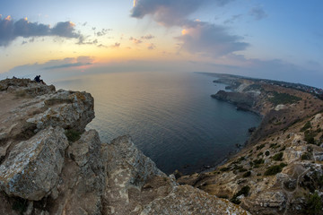 Beautiful panoramic view of sunset in the Black sea from the top of Fiolent cape, Crimea. Fisheye lens effect.