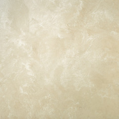 Textured background. Decorative plaster walls, external decoration of facade. Texture of beige