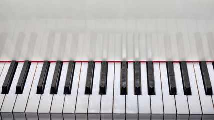 Close Up view of a grand piano white keyboard