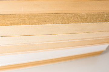 Many stacked books with white background with space