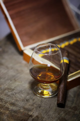 Large box of Cuban cigars on a wooden table