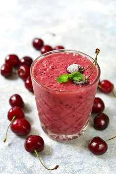 Cherry banana smoothie in a glass.