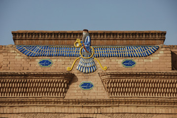 Zoroastrian symbol Faravahar from the facade of a fire temple in Yazd 