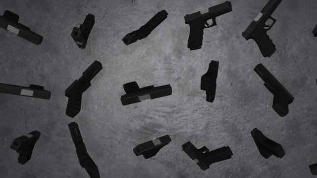Guns. Pistols isolated on the grey wall. Guns revolve