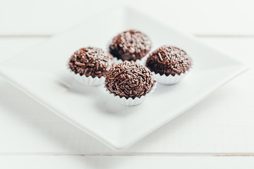 Brigadeiro is a typical homemade chocolate truffle from Brazil. Cocoa, condensed milk and sprinkles of chocolate. Common in children birthday party.