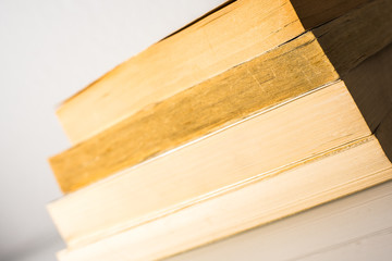Many stacked books with white background with space