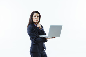 Portrait of a standing businesswoman holding laptop and looking at camera, isolated on white