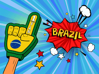 Male hand in the country flag glove of a sports fan raised up celebrating win and Brazil speech bubble with stars and clouds. Colorful illustration in retro comic style