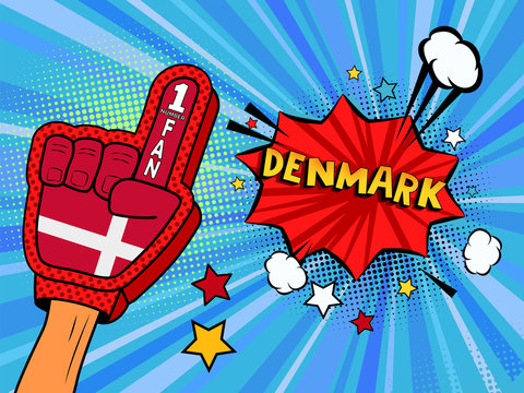 Male Hand In The Country Flag Glove Of A Sports Fan Raised Up Celebrating Win And Denmark Speech Bubble With Stars And Clouds. Colorful Illustration In Retro Comic Style