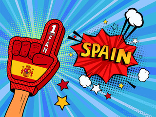 Fototapeta premium Male hand in the country flag glove of a sports fan raised up celebrating win and Spain speech bubble with stars and clouds. Colorful illustration in retro comic style