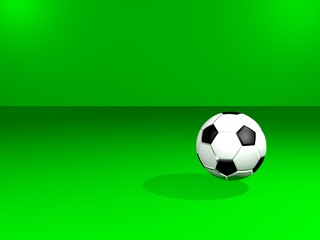 Balon de fútbol en fondo verde