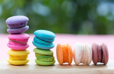 Pile of french colorful macarons on table.