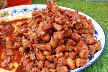 Sweet and sour pork in white plate.