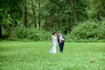 Wedding couple on the nature is walking