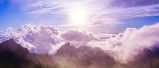 Amazing view of mountain peaks with beautiful clouds on the sunset. Location: Tenerife, Canary...