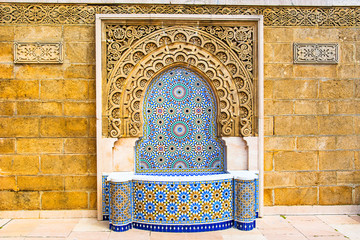 Moroccan style fountain with fine colorful mosaic tiles at the Mohammed V mausoleum in Rabat Morocco - obrazy, fototapety, plakaty