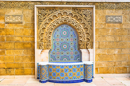 Moroccan style fountain with fine colorful mosaic tiles at the Mohammed V mausoleum in Rabat Morocco