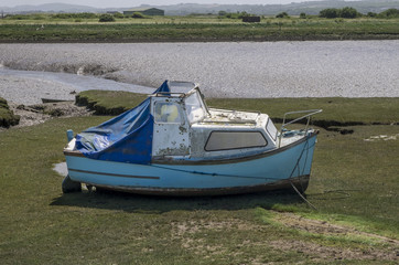 boats beached at low tide in dry estuary in braunton, devon, north, british, united, kingdom