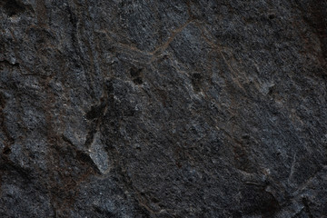Dark stones texture pattern nature background.