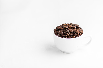 Coffee and coffee beans in white cups, white background