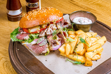 Burger with pastrami and fries