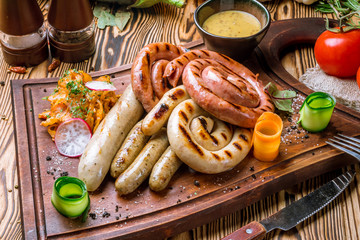 assorted sausages with sauces