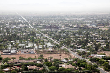 Tilted road and bare lot of a construction site in Scottsdale, Arizona
