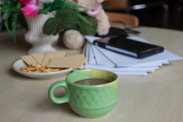 Coffee with  bread  in the morning on Desk for work
