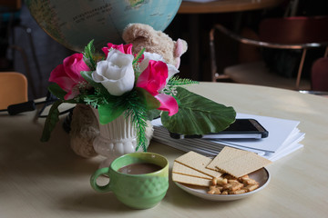Coffee with  bread  in the morning on Desk for work
