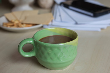 Coffee with  bread  in the morning on Desk for work
