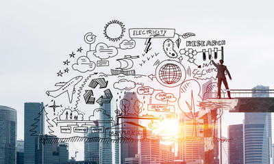 Businessman drawing ecological conceptual sketches