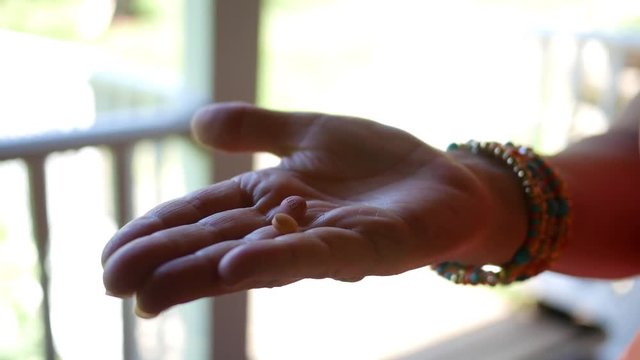 Woman holding doxycyclline medication for Lyme disease
