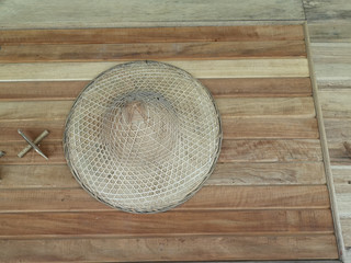 Fototapeta na wymiar Farmer's hat on wooden background.