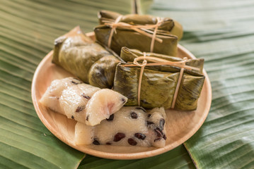 Glutinous rice steamed in banana leaf ( Khao Tom Mat or Khao Tom Pad ), Thailand.