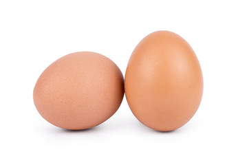 Two brown eggs isolated on white background cutout