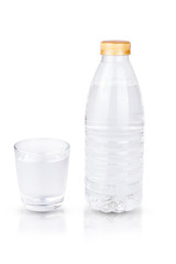 bottle of water and empty glass isolated on white background