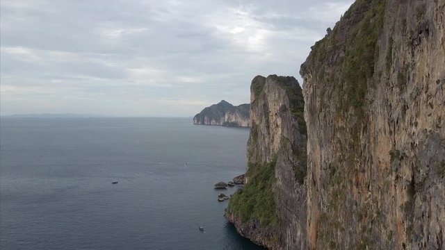 AERIAL: Lime stone cliffs high above the beach Phi Phi islands