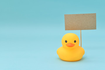 Feedback concept, rubber ducks are holding blank signboard