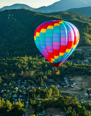 Hot Air Balloon Flying Through the Valley Over Grants Pass, Oregon in the Morning