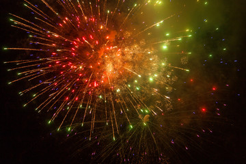 Obraz premium Red, orange and green fireworks